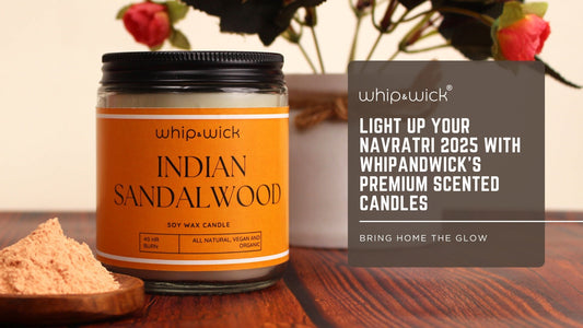 Whipandwick Indian Sandalwood soy wax candle in a glass jar with an orange label placed on a wooden surface beside sandalwood powder, with text promoting Navratri 2025 premium scented candles.