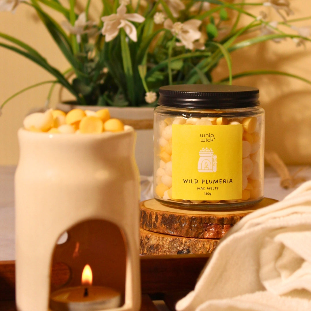 Wild Plumeria Wax Melts combining plumeria, citrus, green moss, and amber for a refreshing floral aroma with a hint of sweetness.