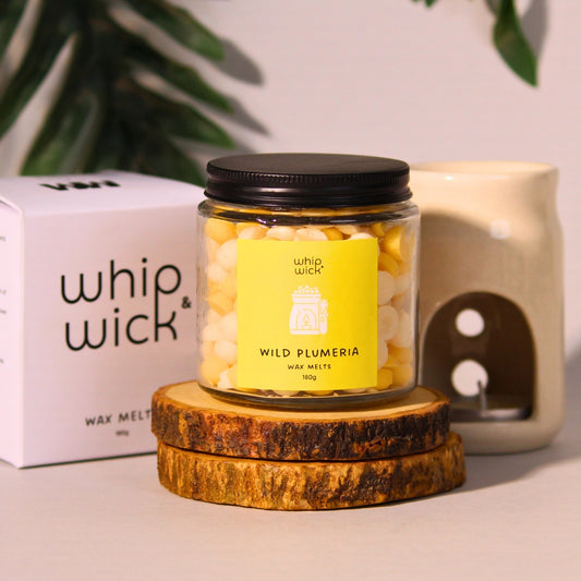 Wild Plumeria Wax Melts combining plumeria, citrus, green moss, and amber for a refreshing floral aroma with a hint of sweetness.