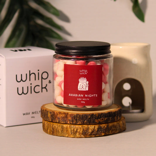 Arabian Knights wax melts  with a rich, luxurious fragrance of roses, amberwood, and dark oud for a warm and exotic atmosphere.