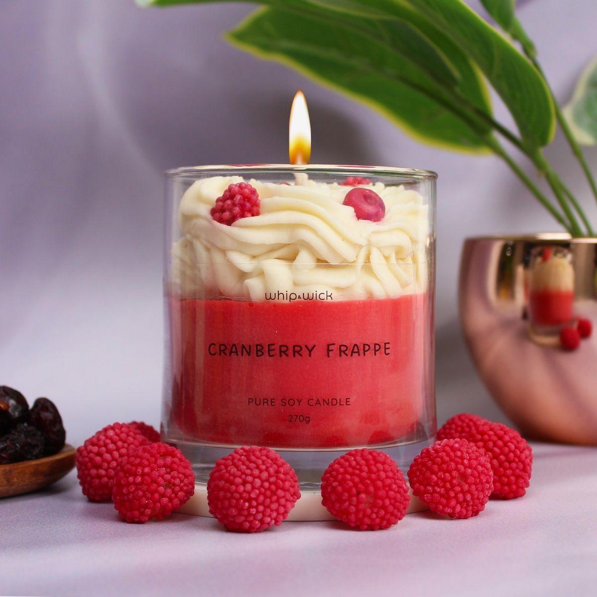 Cranberry Frappe Scented Candle with top notes of cranberries and mint, middle notes of whipped cream and sugar, and a vanilla base for a refreshing aroma.