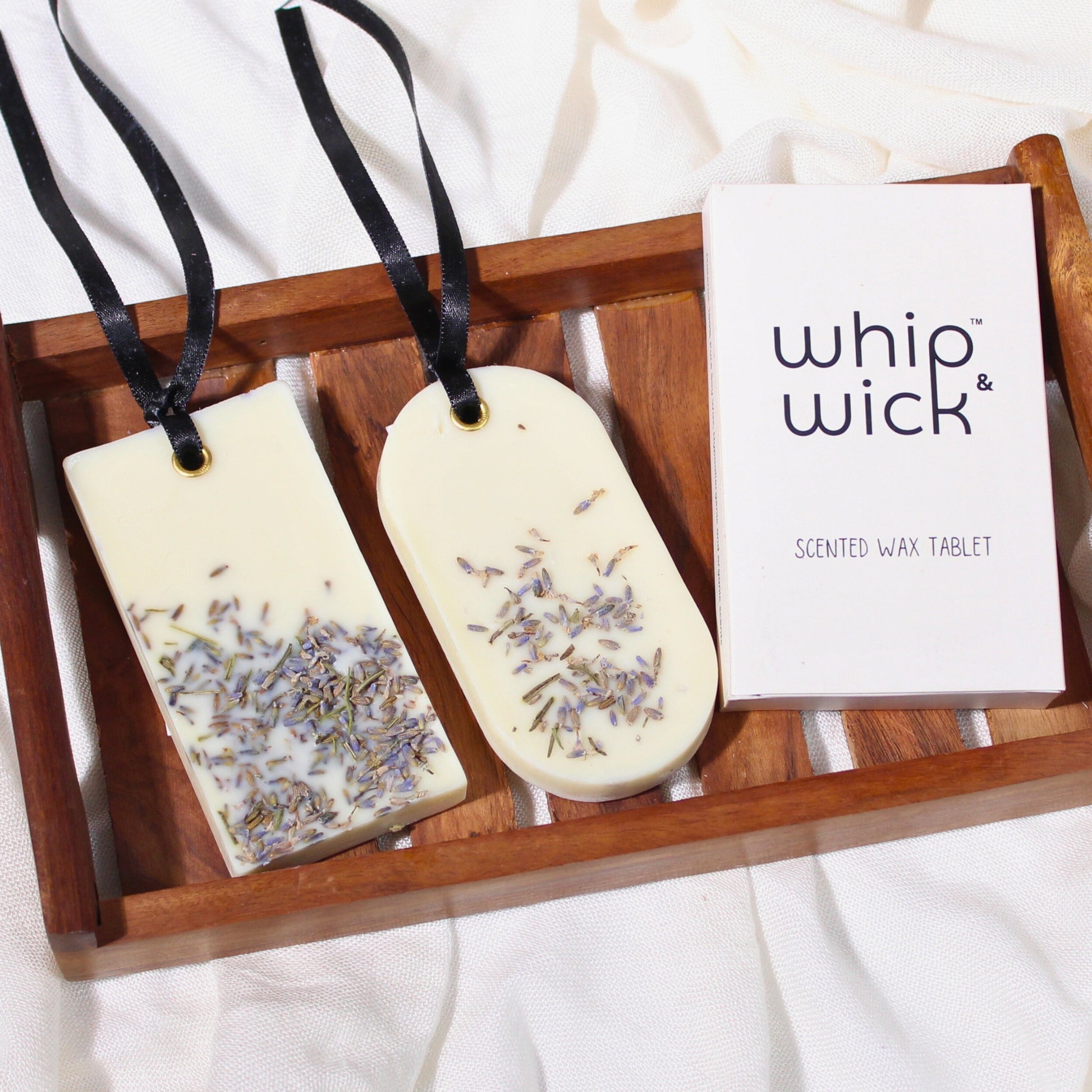 Lavender Land Wax Tablet with soothing lavender, fresh herbs, sea salt, patchouli, and vetiver for a calming and earthy fragrance experience.