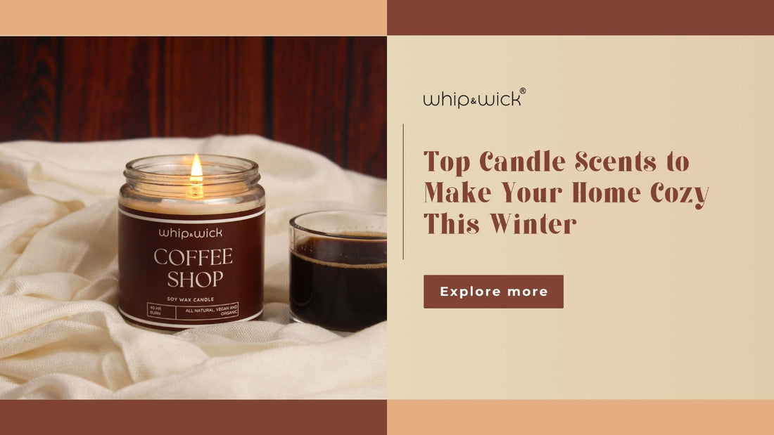 Whip and Wick Coffee Shop soy wax candle burning beside a cup of coffee on a cozy beige fabric background with text that reads “Top Candle Scents to Make Your Home Cozy This Winter.